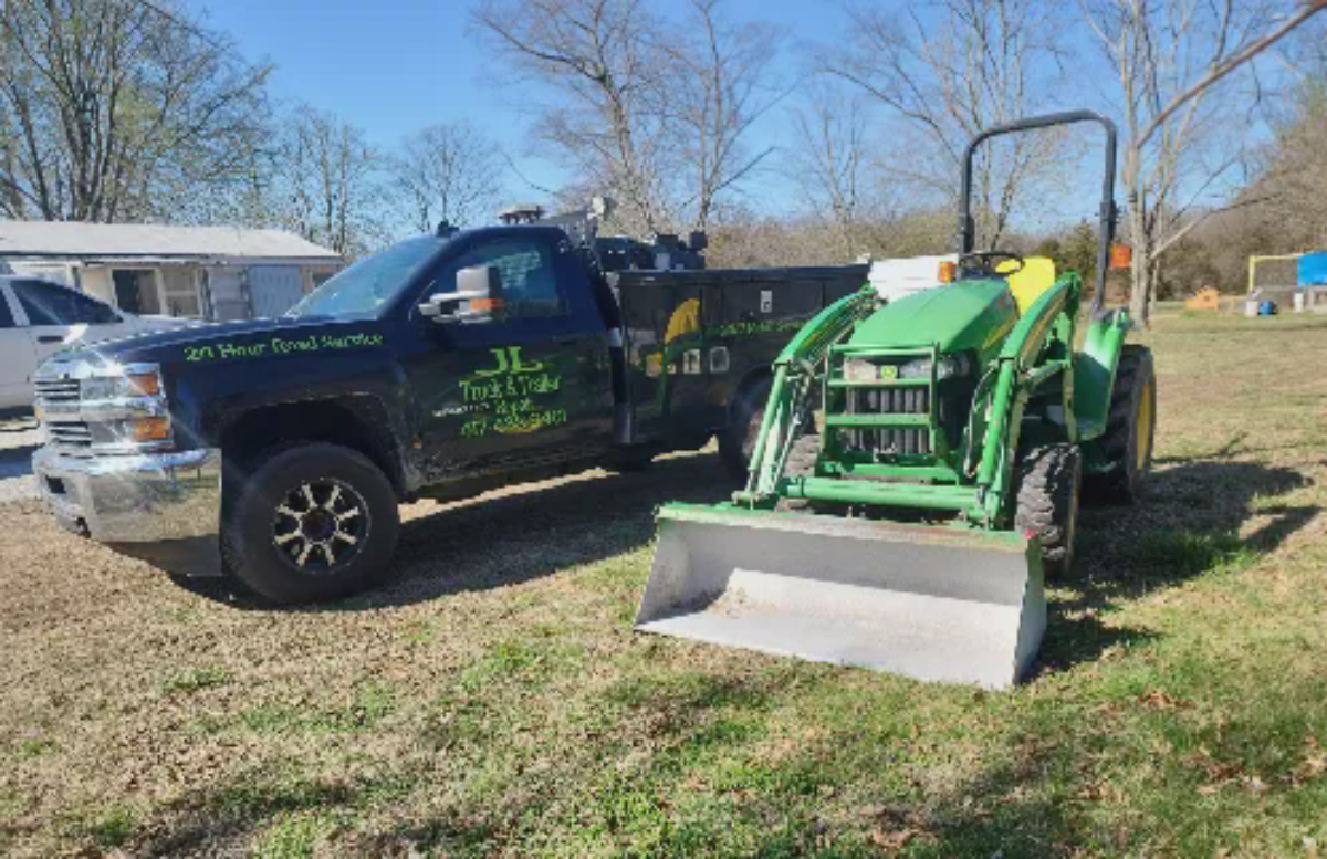 Tractor with front loader on a worksite