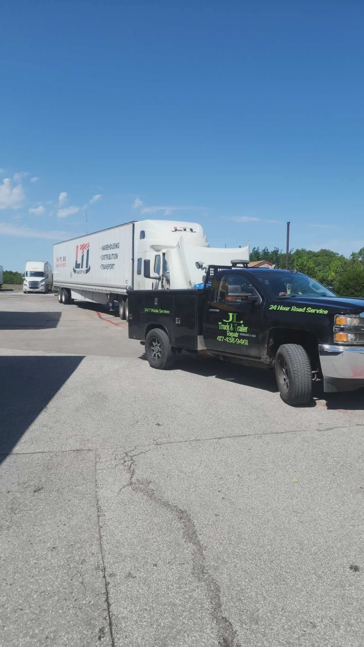Semi truck and trailer at JL Mobile shop