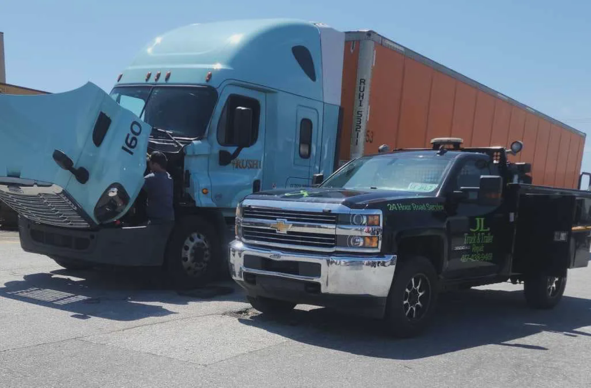 JL Mobile service truck and semi truck at the shop yard